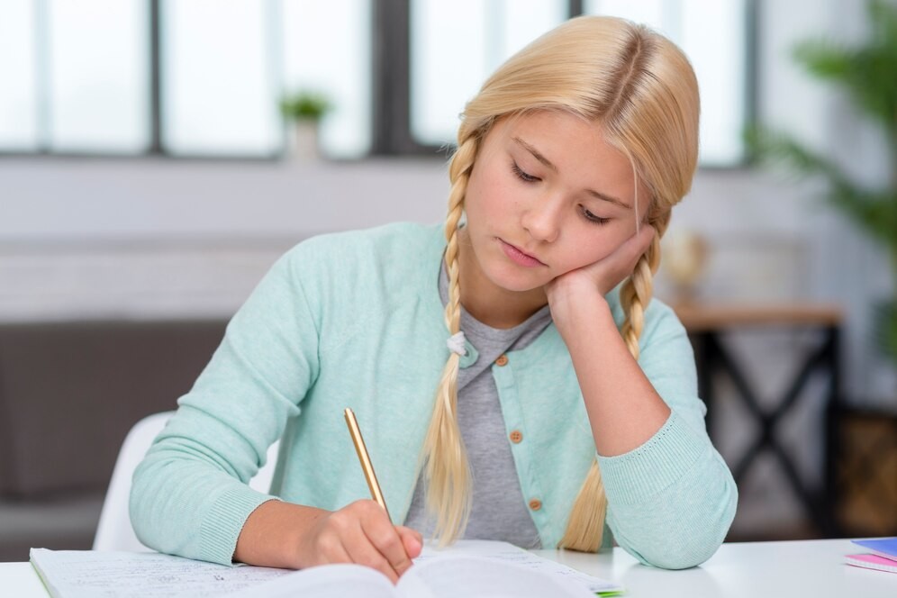 young-blonde-student-looking-bored-writing_23-2148511048