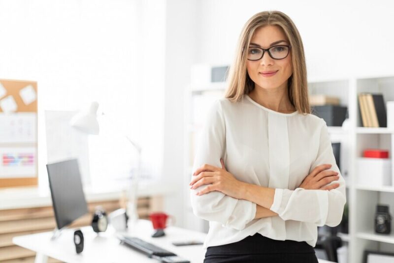 young-girl-is-standing-leaning-table-office_88135-1539