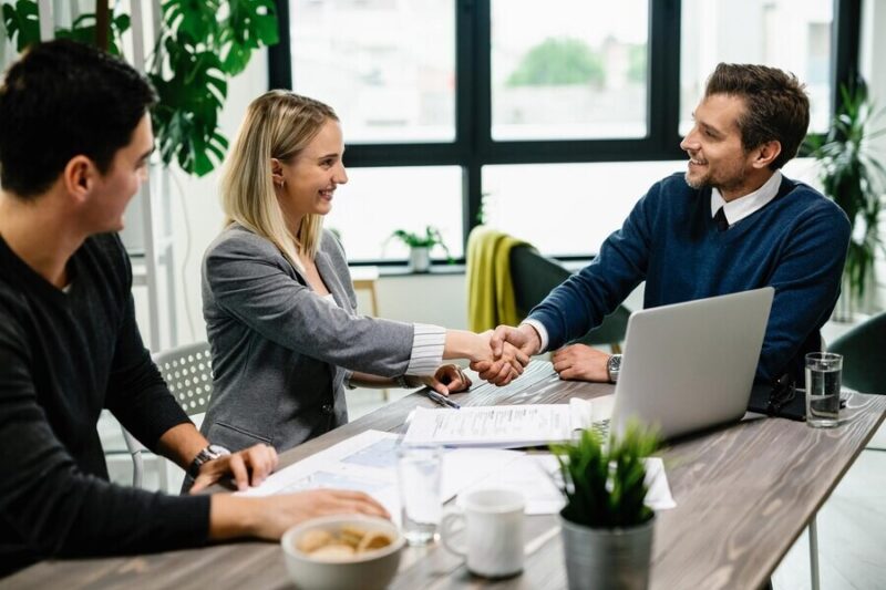 young-happy-couple-meeting-with-financial-advisor-office-woman-is-handshaking-with-agent_637285-3904