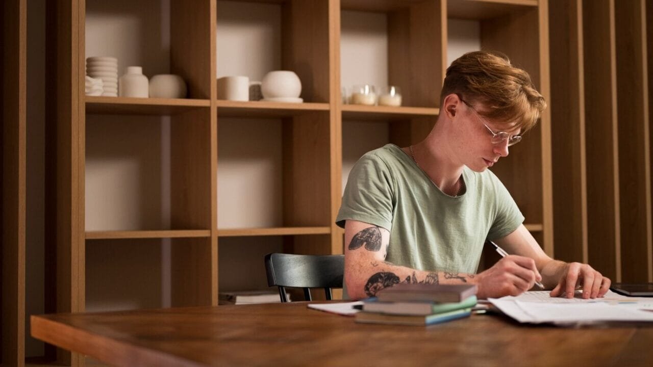 young-man-learning-virtual-classroom_23-2149200189
